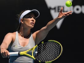 Danielle Collins serving the ball during a tennis match.