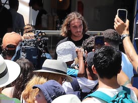 Stefanos Tsitsipas surrounded by fans